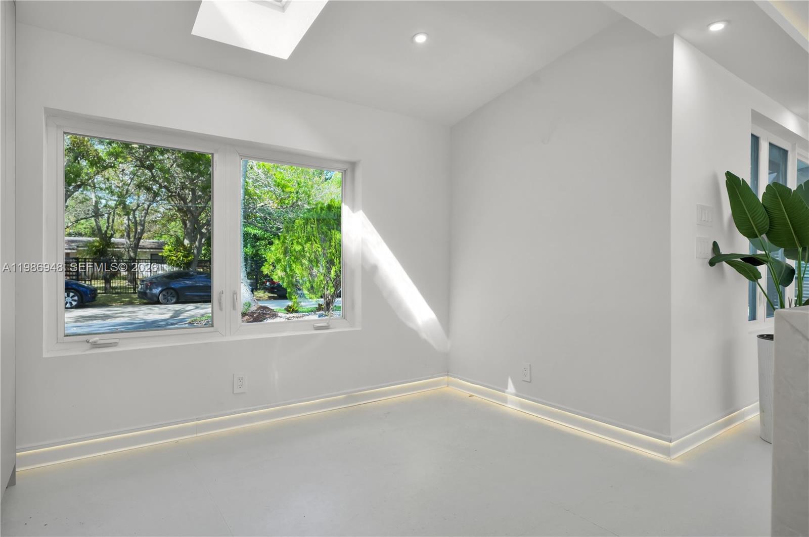 8220 Southwest 133rd Street Pinecrest, FL 33156 - Photo 13 of 34 an empty room with a window