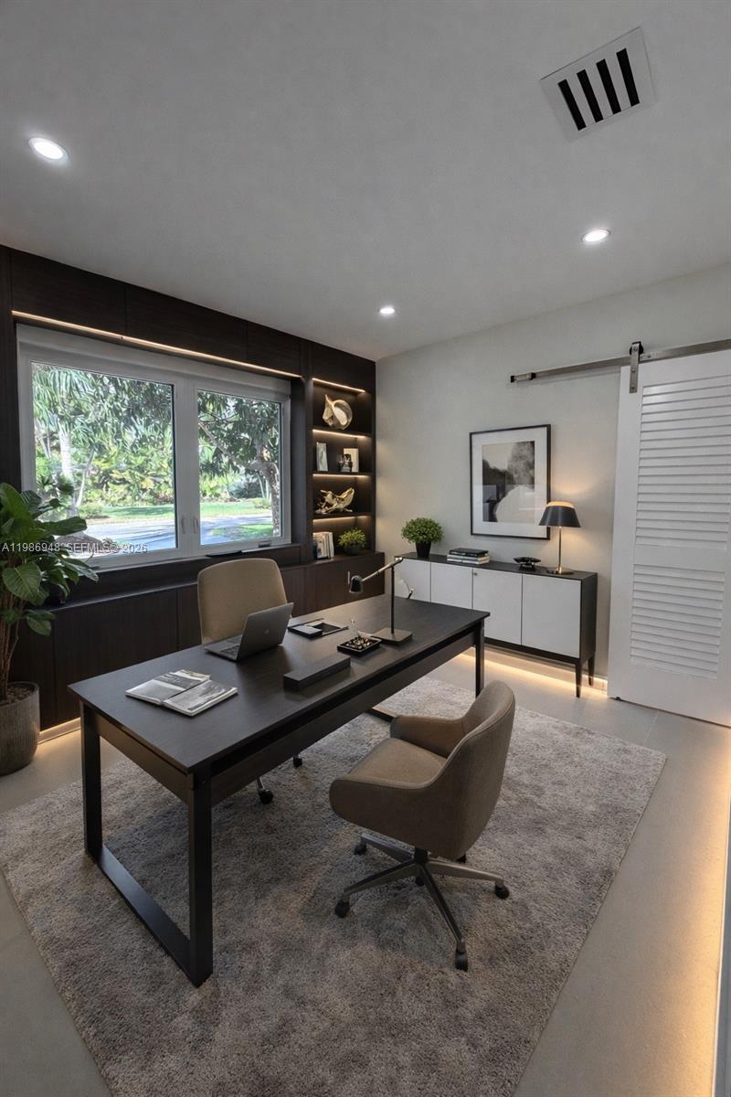8220 Southwest 133rd Street Pinecrest, FL 33156 - Photo 23 of 34 a living room with furniture and a large window