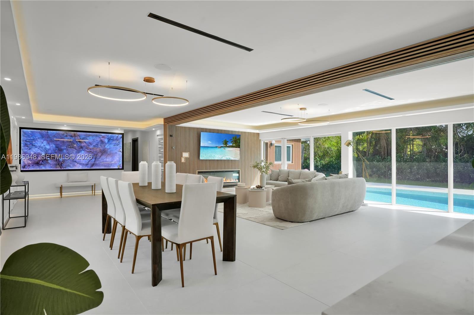 8220 Southwest 133rd Street Pinecrest, FL 33156 - Photo 6 of 34 a dining room with furniture and a large window
