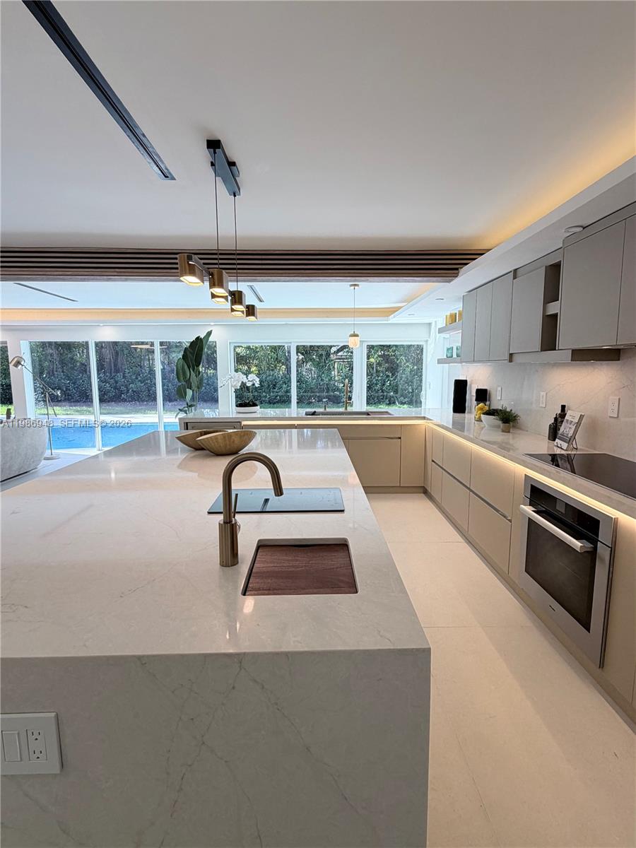 8220 Southwest 133rd Street Pinecrest, FL 33156 - Photo 10 of 34 a living room with furniture and a large window
