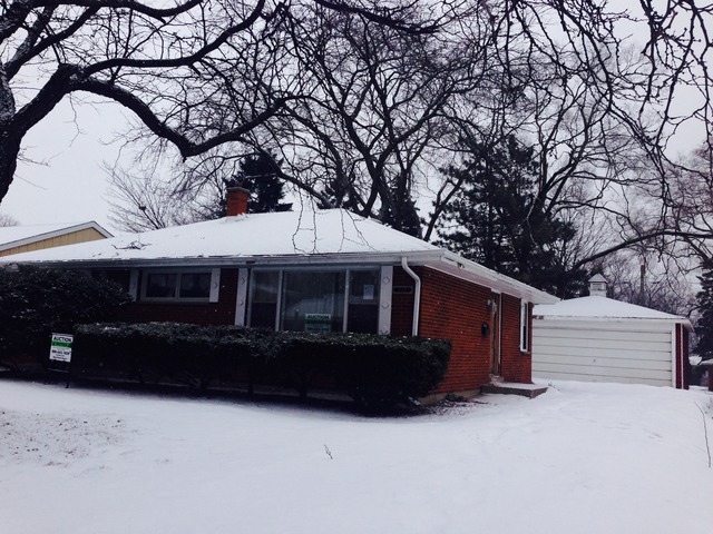 a front view of house with yard in background