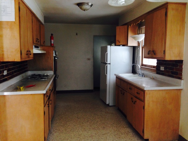 517 North McAree Road Waukegan, IL 60085 - Photo 3 of 10 a kitchen with stainless steel appliances granite countertop a refrigerator a stove and a sink