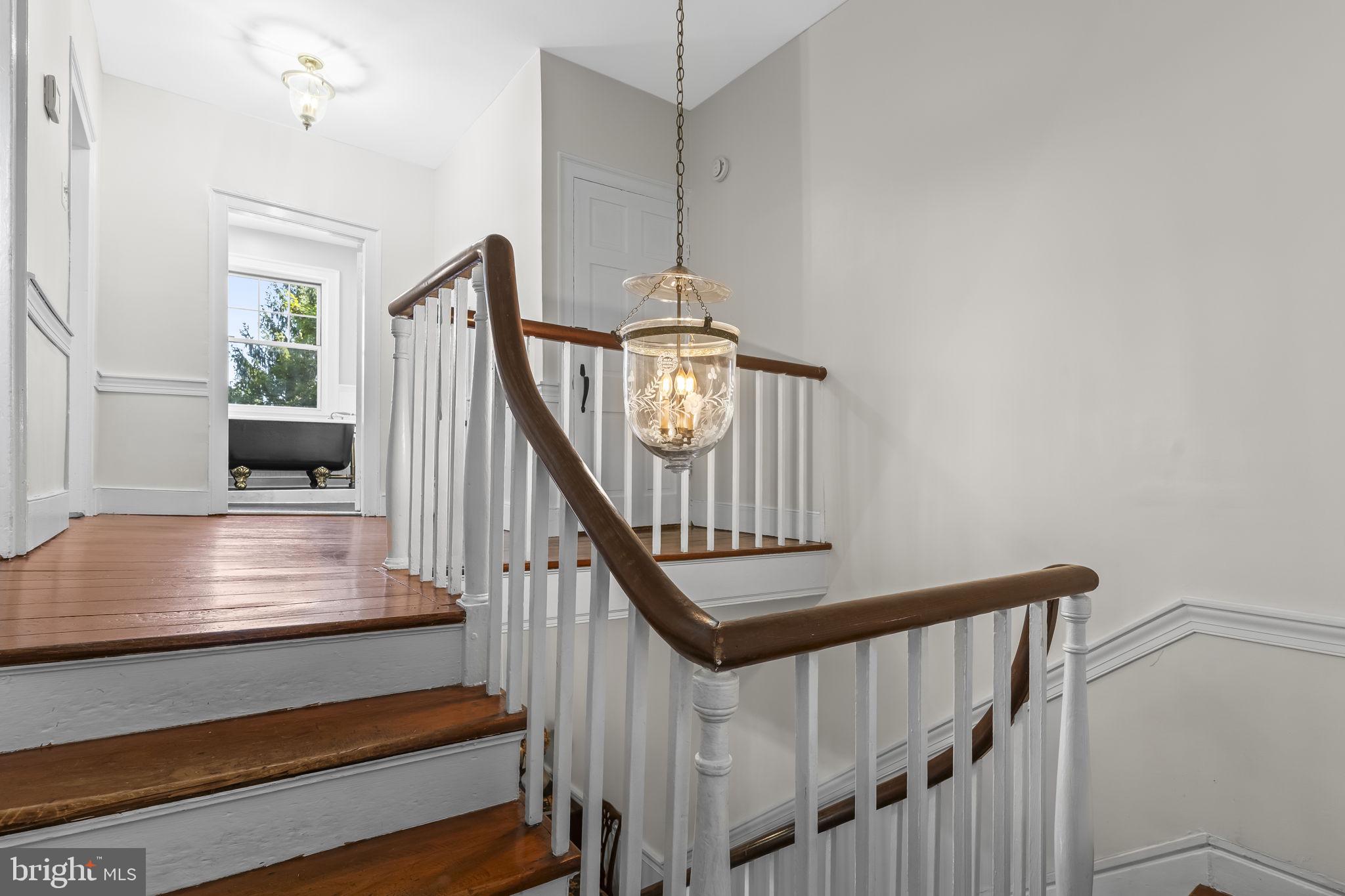 525 Small Reward Road Huntingtown, MD 20639 - Photo 12 of 67 a view of entryway and hall with wooden floor