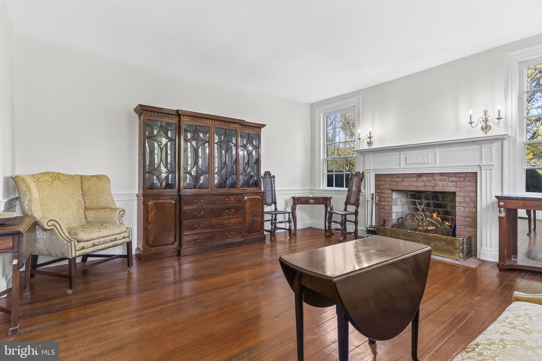 525 Small Reward Road Huntingtown, MD 20639 - Photo 14 of 67 a living room with furniture and a fireplace