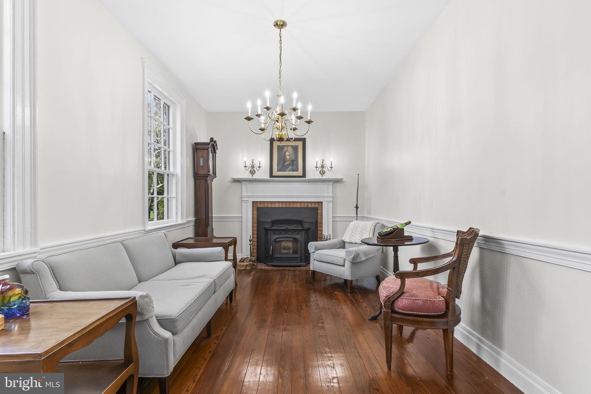525 Small Reward Road Huntingtown, MD 20639 - Photo 16 of 67 a living room with furniture and a fireplace
