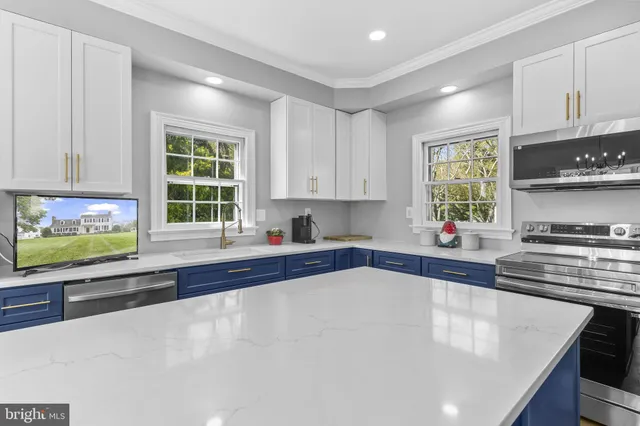 a view of hallway with stairs and wooden floor