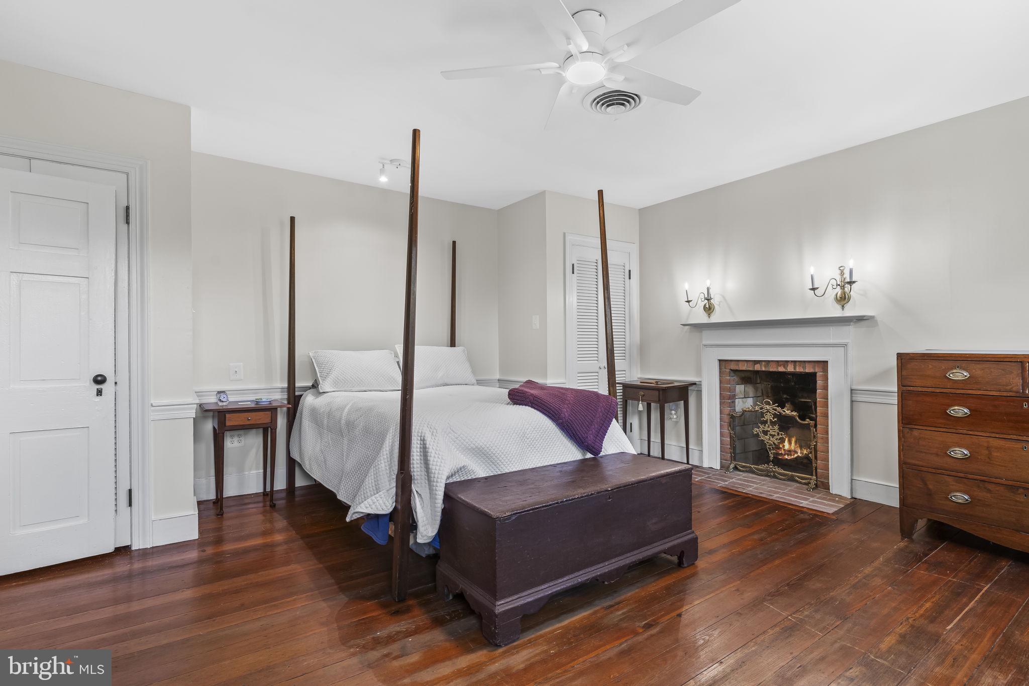 525 Small Reward Road Huntingtown, MD 20639 - Photo 28 of 67 a living room with furniture and a fireplace