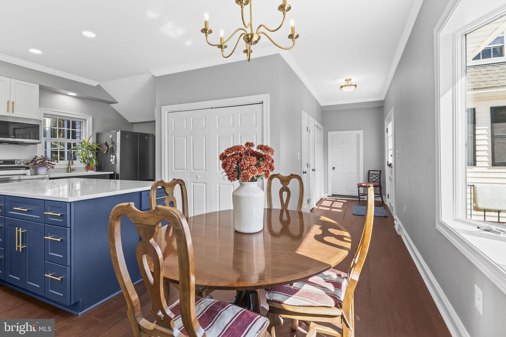 525 Small Reward Road Huntingtown, MD 20639 - Photo 28 of 67 a dining room with furniture and wooden floor
