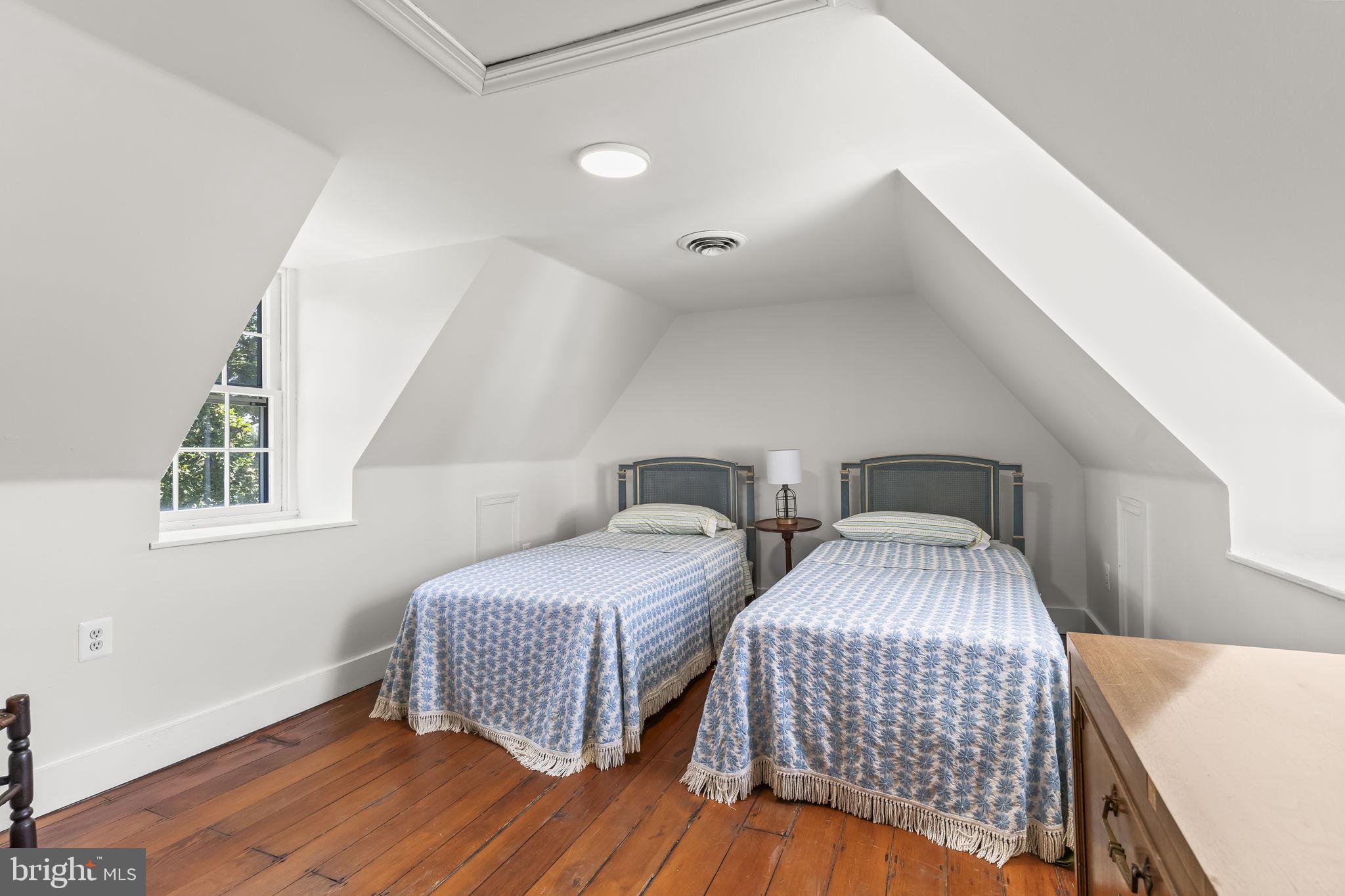 525 Small Reward Road Huntingtown, MD 20639 - Photo 36 of 67 a bedroom with two beds and a large window