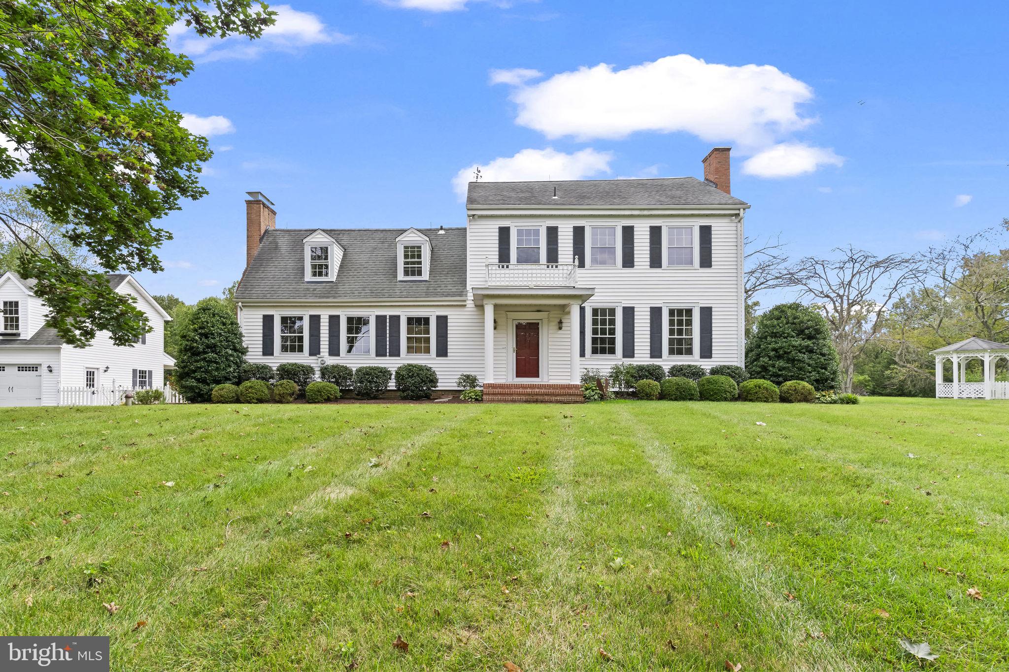 525 Small Reward Road Huntingtown, MD 20639 - Photo 42 of 67 a front view of a house with a yard