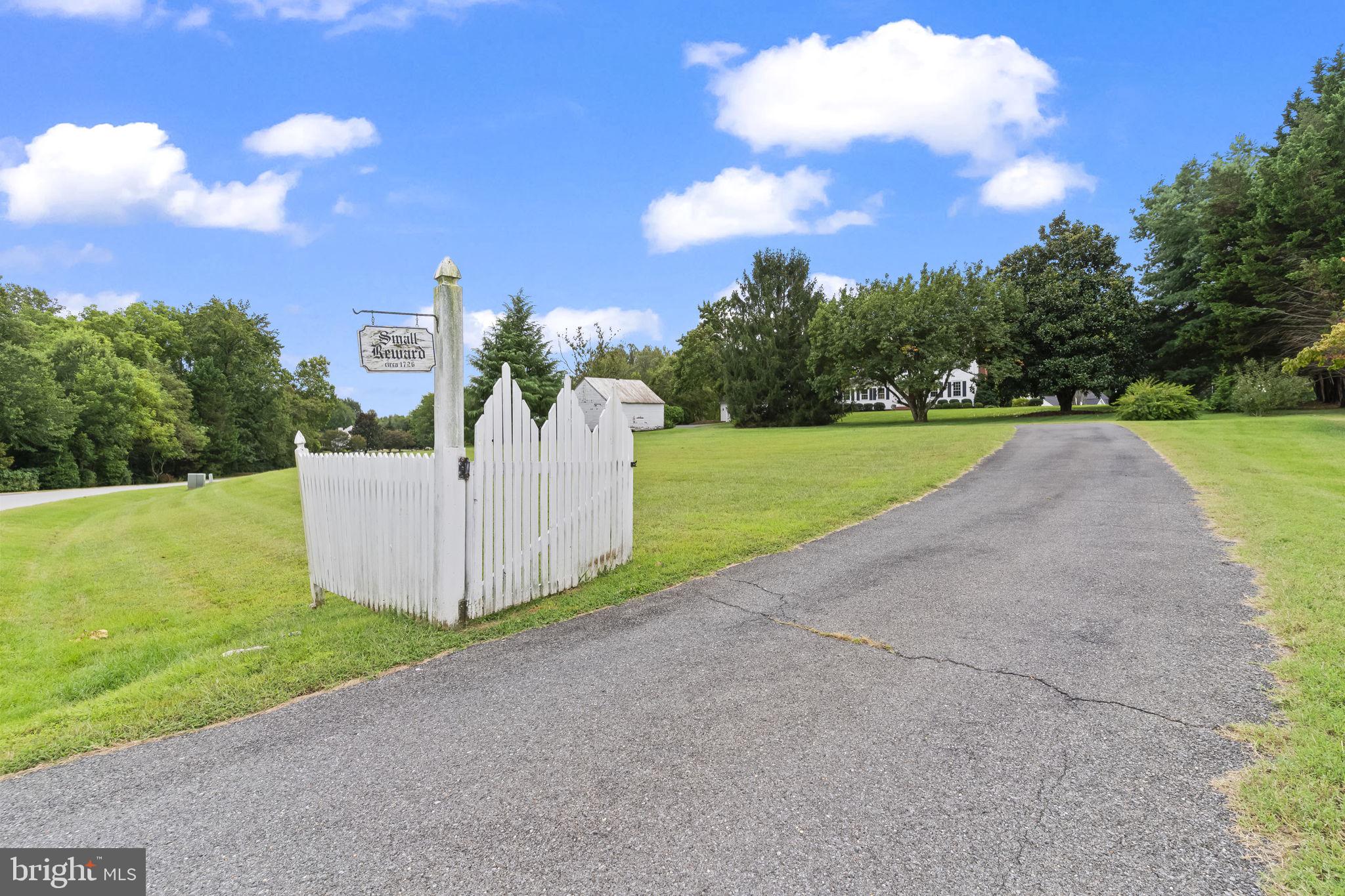 525 Small Reward Road Huntingtown, MD 20639 - Photo 43 of 67 a view of a garden with a building in the background