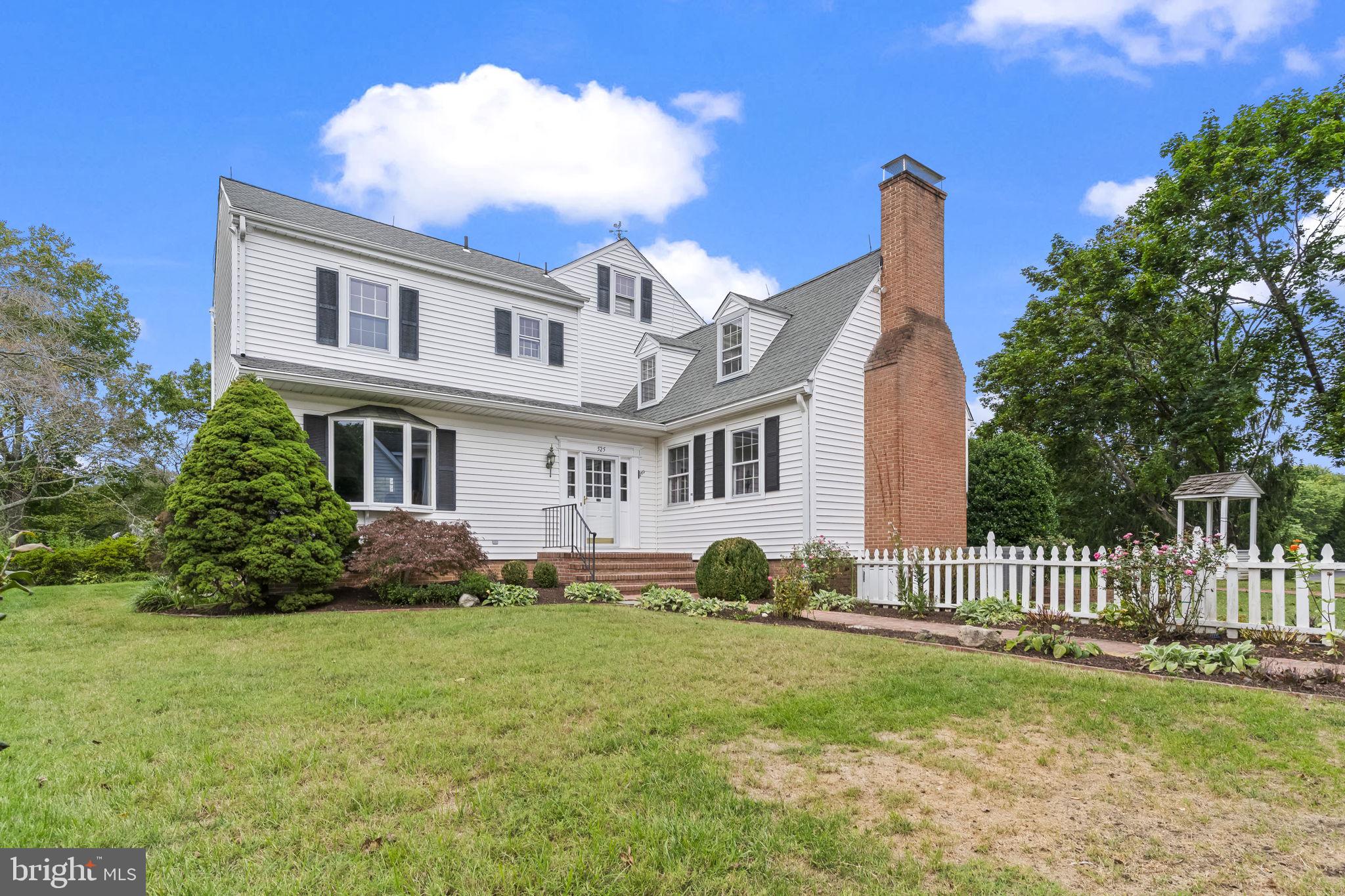 525 Small Reward Road Huntingtown, MD 20639 - Photo 48 of 67 a front view of a house with a garden