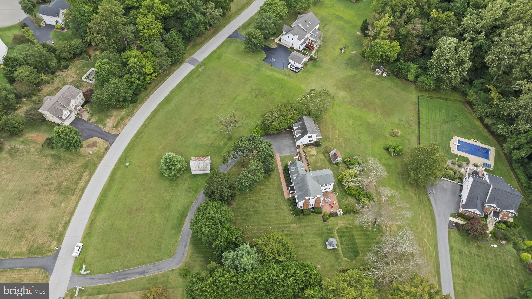 525 Small Reward Road Huntingtown, MD 20639 - Photo 50 of 67 an aerial view of a residential houses with outdoor space and trees all around