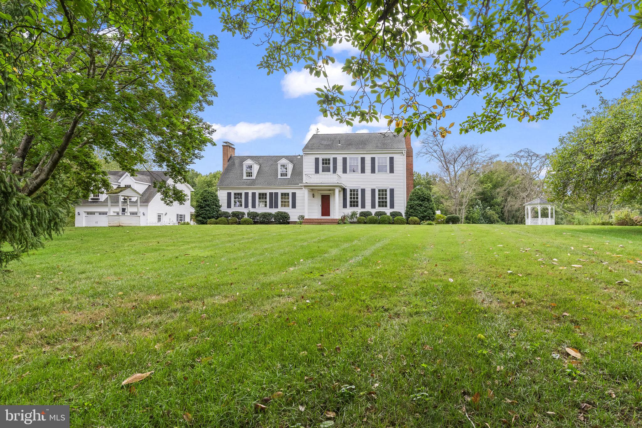 525 Small Reward Road Huntingtown, MD 20639 - Photo 55 of 67 a view of a house with a big yard and large trees