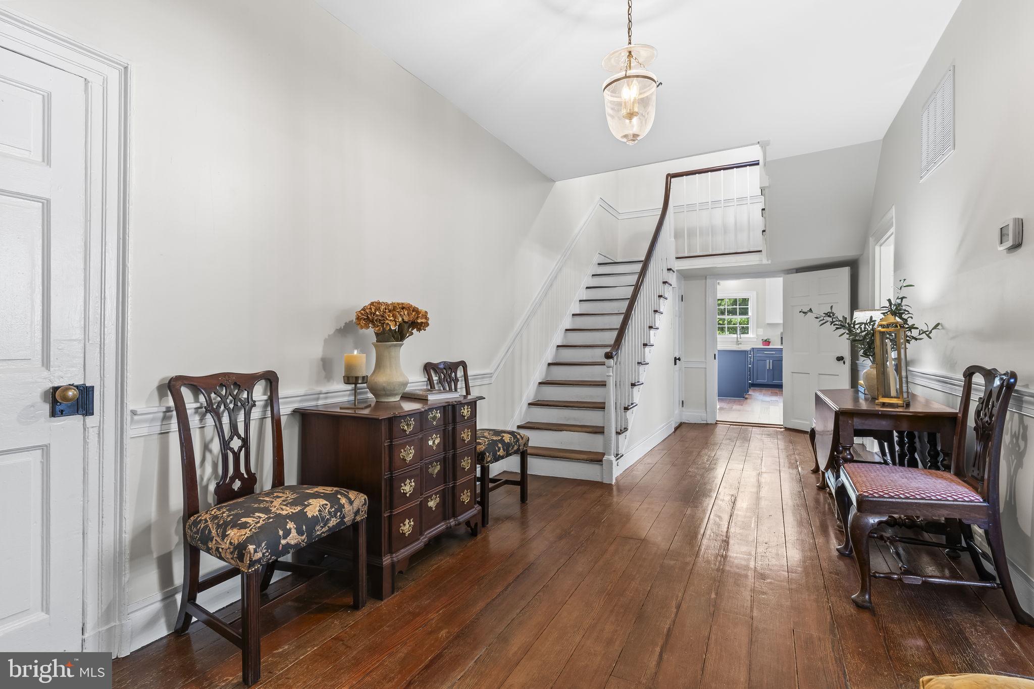 525 Small Reward Road Huntingtown, MD 20639 - Photo 9 of 67 a view of a livingroom with furniture wooden floor and windows