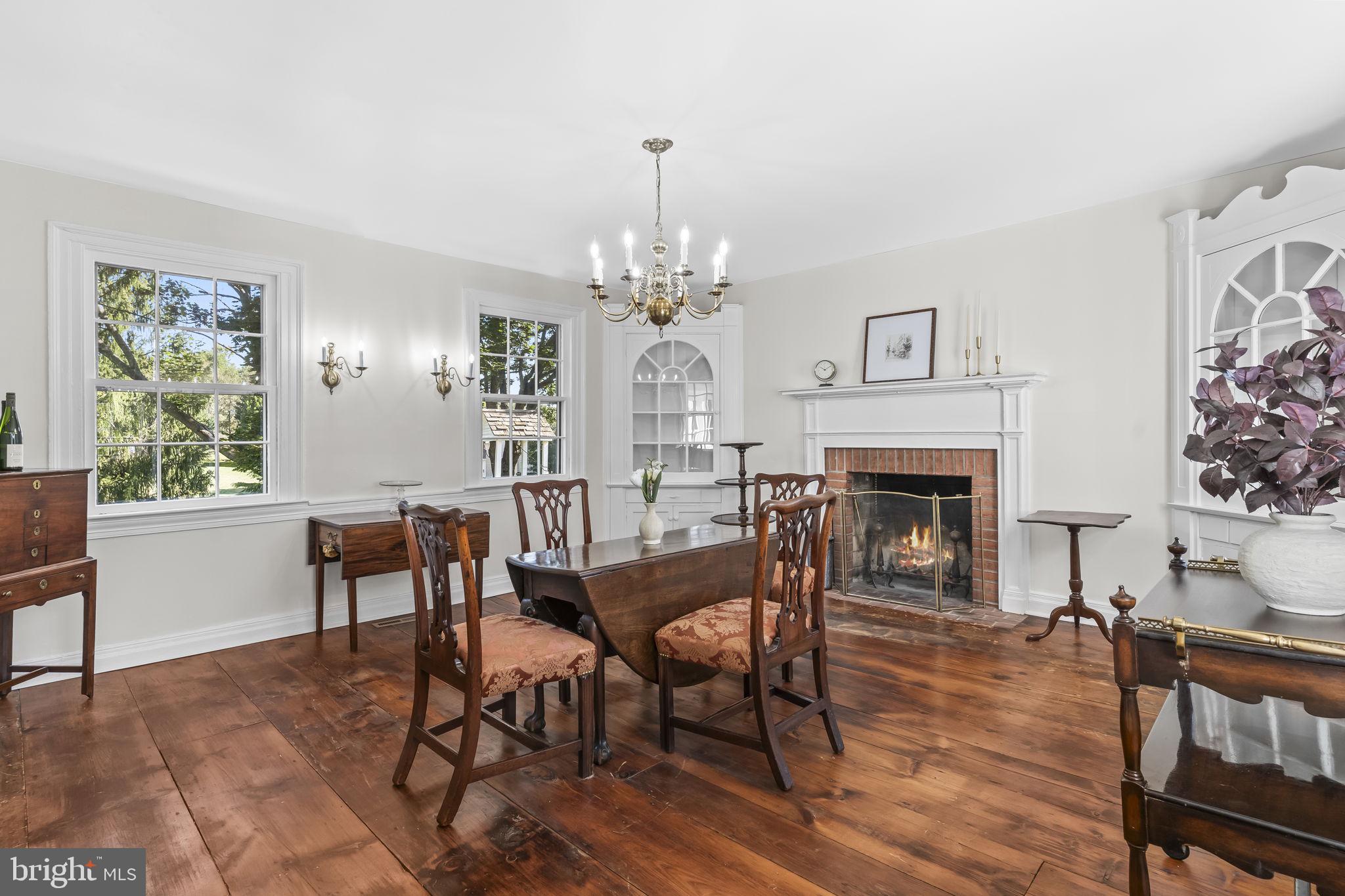 525 Small Reward Road Huntingtown, MD 20639 - Photo 10 of 67 a view of a dining room with furniture a chandelier and wooden floor