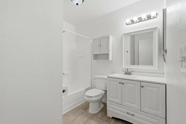 a bathroom with a shower and a toilet