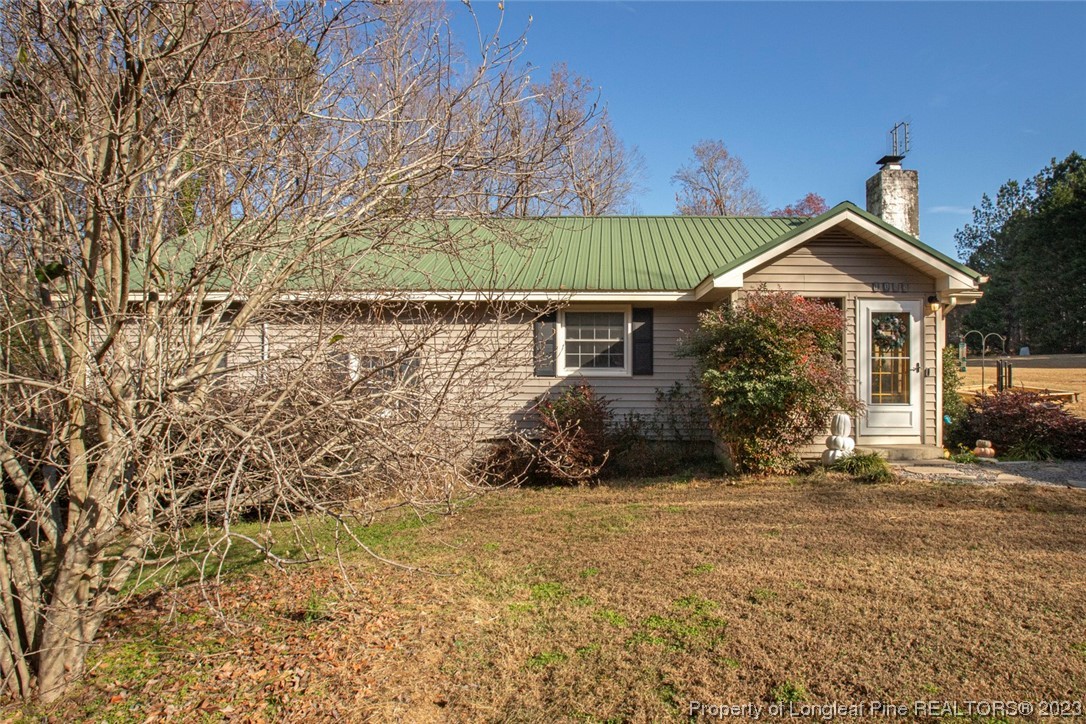 1036 Pendergrass Road Sanford, NC 27330 - Photo 2 of 31 a front view of a house with a yard