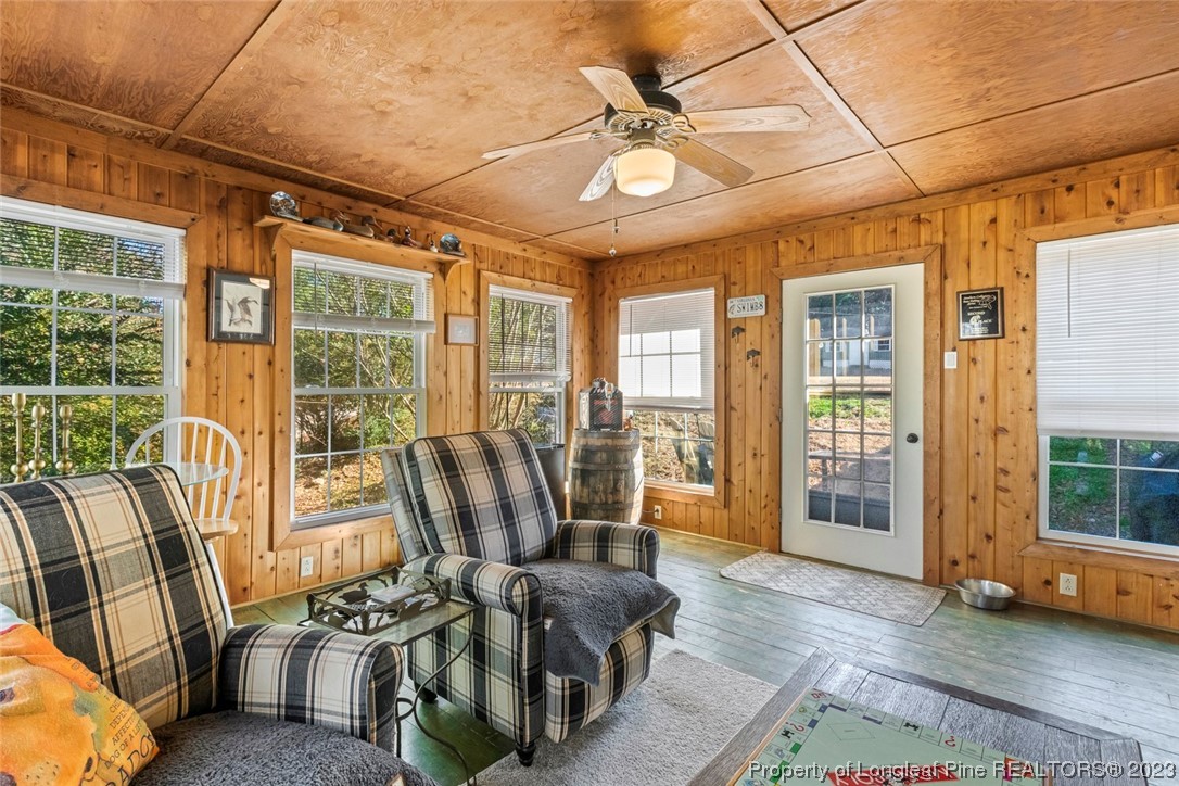 1036 Pendergrass Road Sanford, NC 27330 - Photo 21 of 31 a living room with furniture and large windows