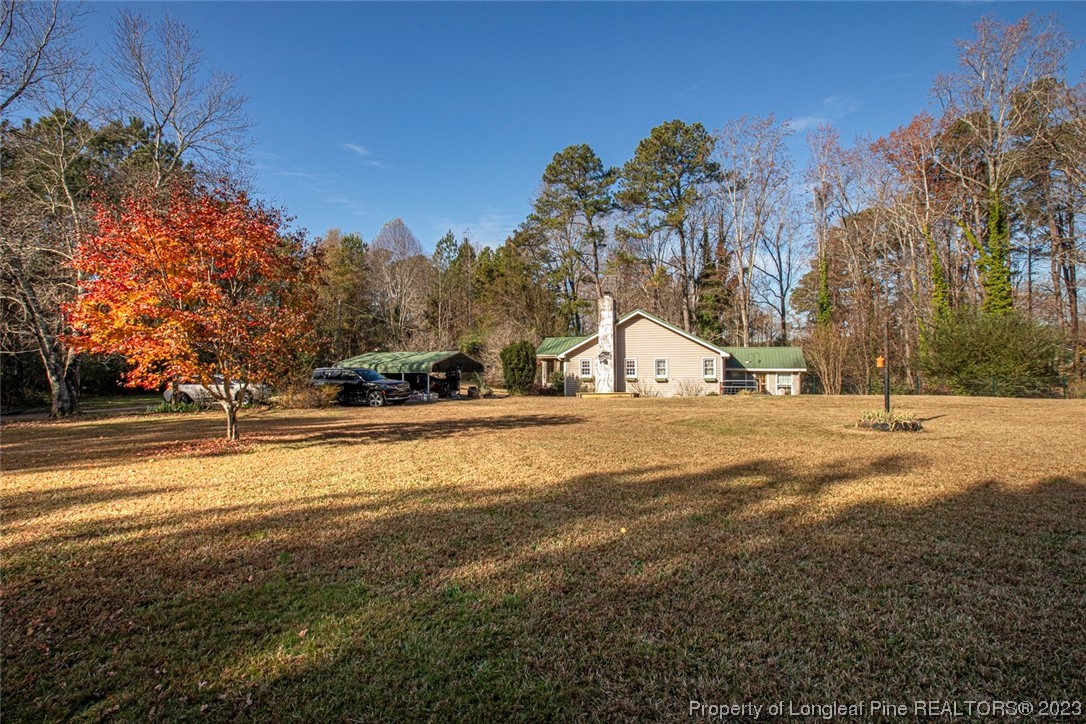1036 Pendergrass Road Sanford, NC 27330 - Photo 3 of 31 a view of road with a building