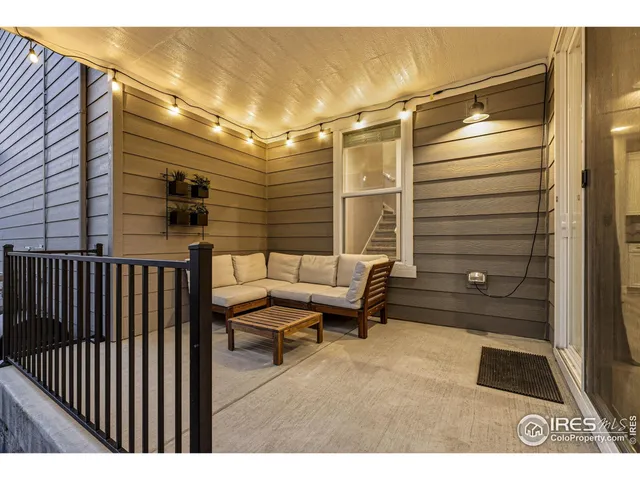 a view of a chairs and table in the balcony