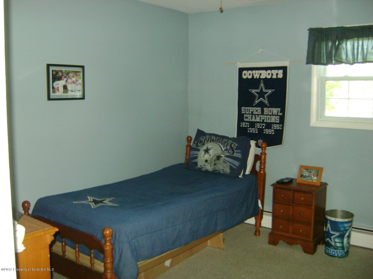 310 Bartron Road Tunkhannock, PA 18657 - Photo 7 of 12 a bed sitting in a bedroom next to a window