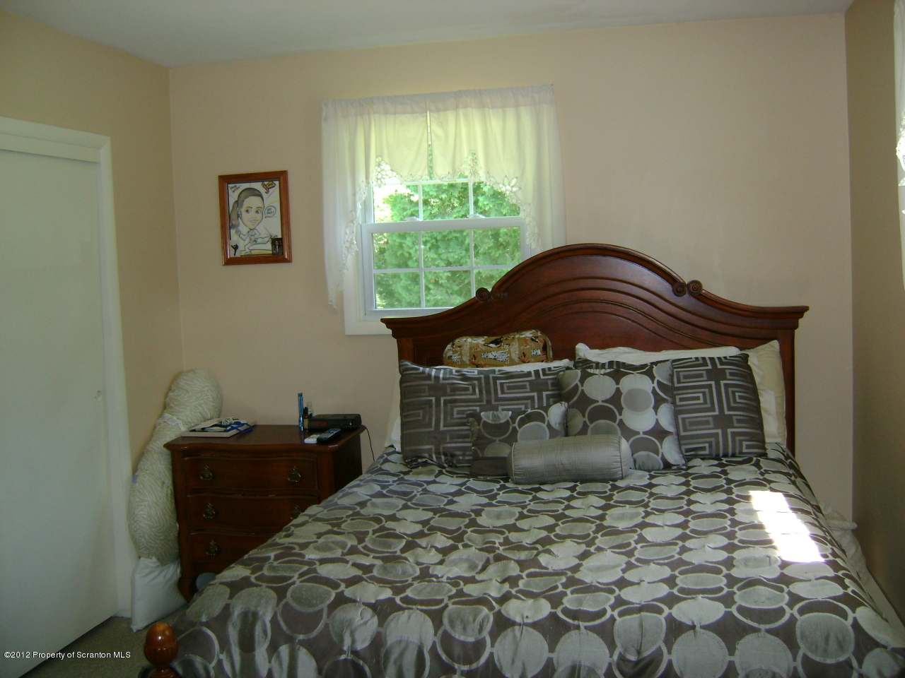 310 Bartron Road Tunkhannock, PA 18657 - Photo 9 of 12 a bed sitting in a bedroom next to a window