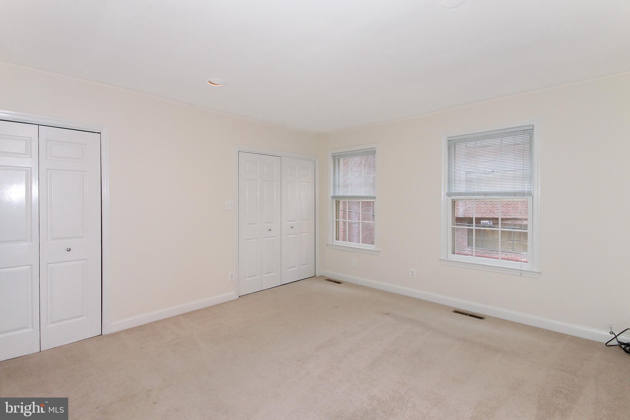 2312 L Street Northwest, Unit 2 Washington, DC 20037 - Photo 12 of 13 an empty room with windows