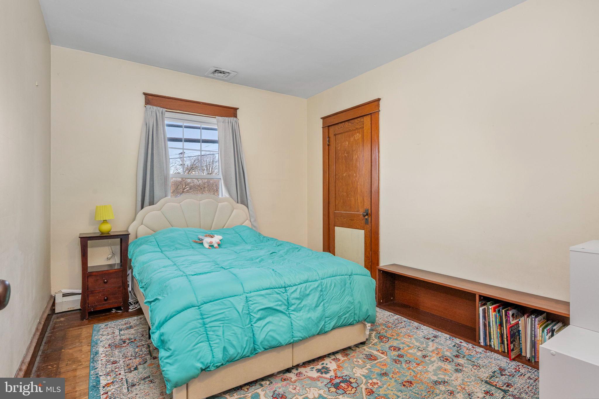 19 East 2nd Avenue Lititz, PA 17543 - Photo 13 of 32 a bedroom with a bed and a dresser