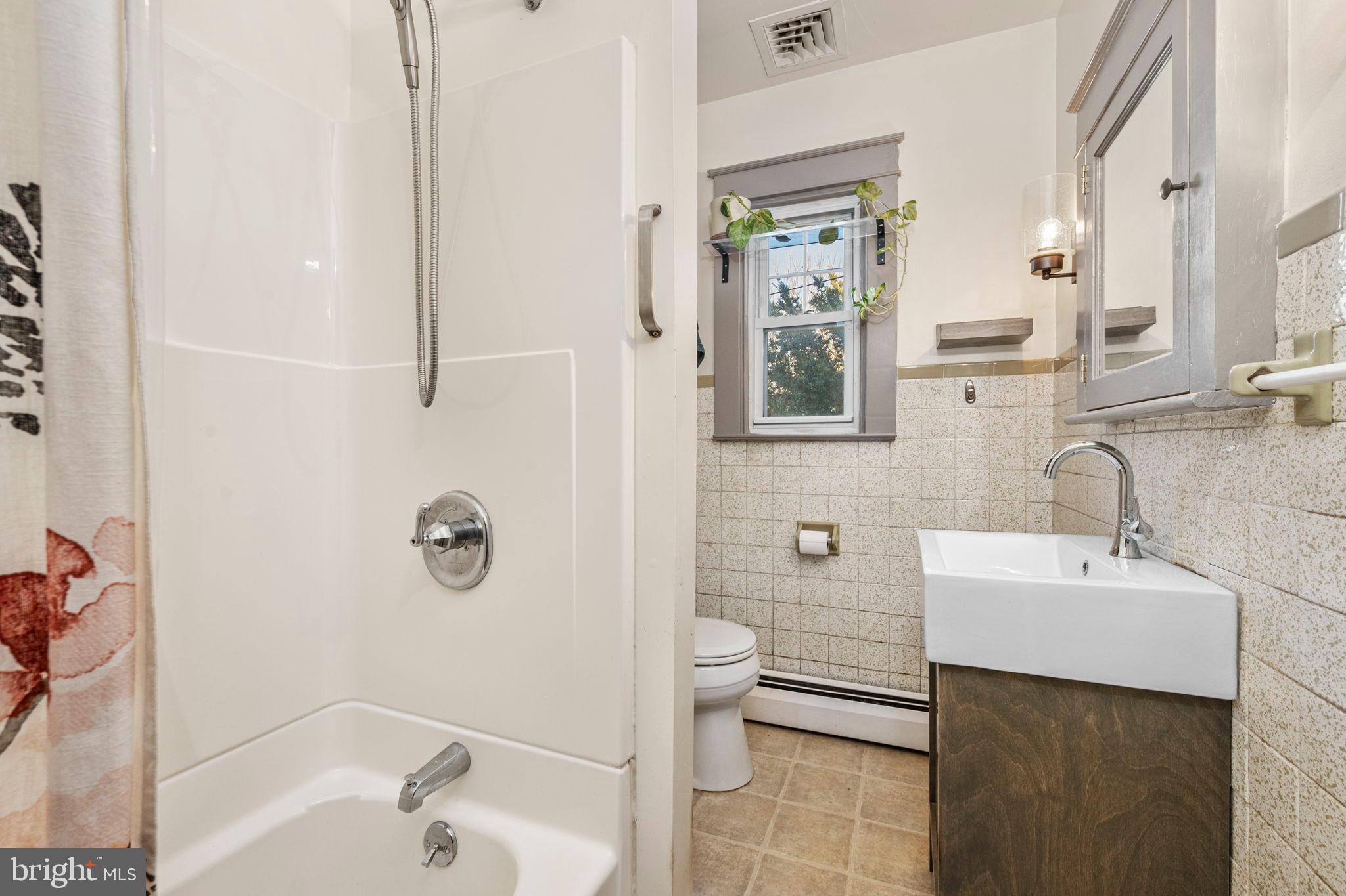 19 East 2nd Avenue Lititz, PA 17543 - Photo 16 of 32 a bathroom with a sink a toilet and shower
