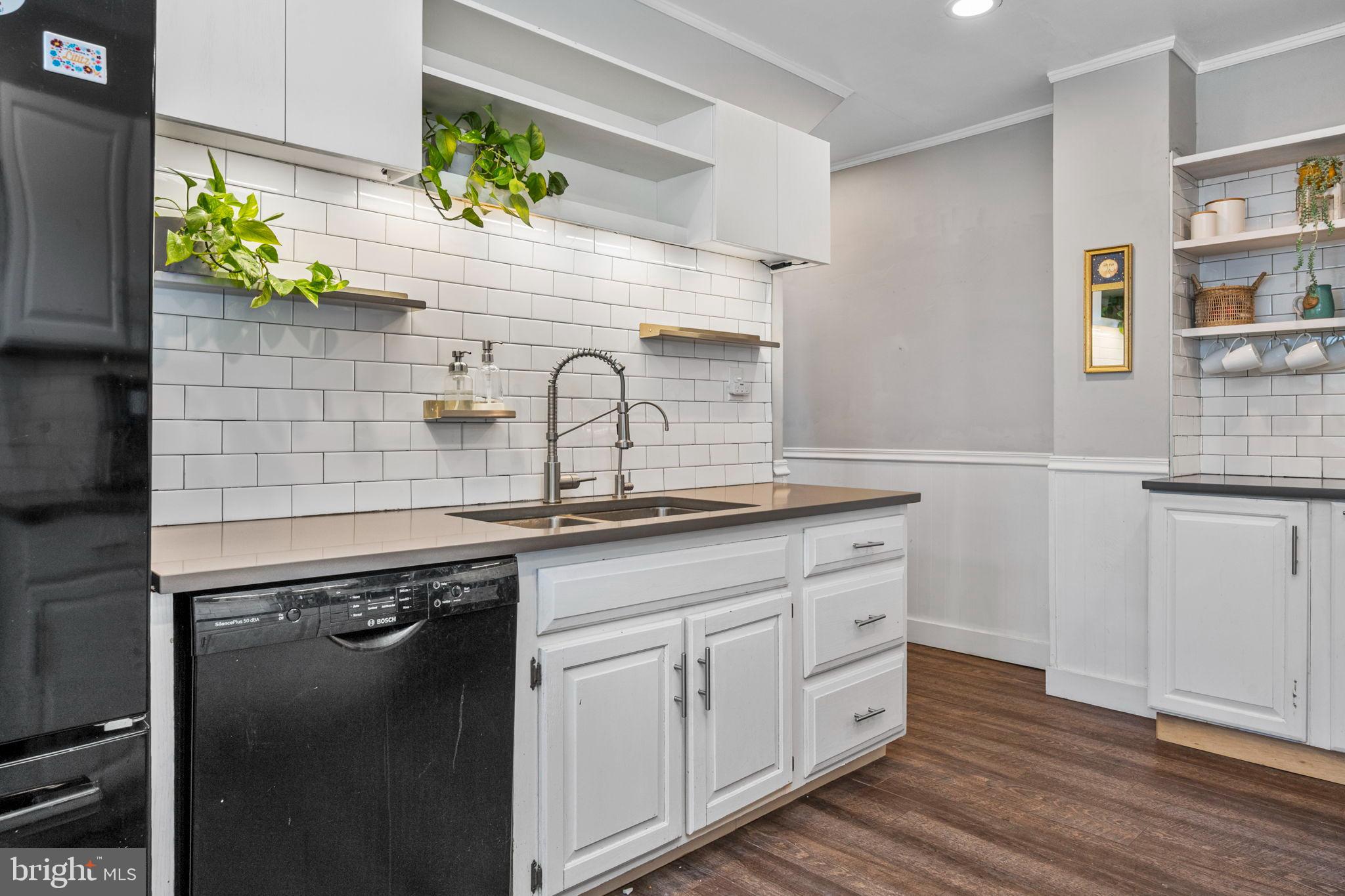 19 East 2nd Avenue Lititz, PA 17543 - Photo 8 of 32 a kitchen with white cabinets and wooden floor