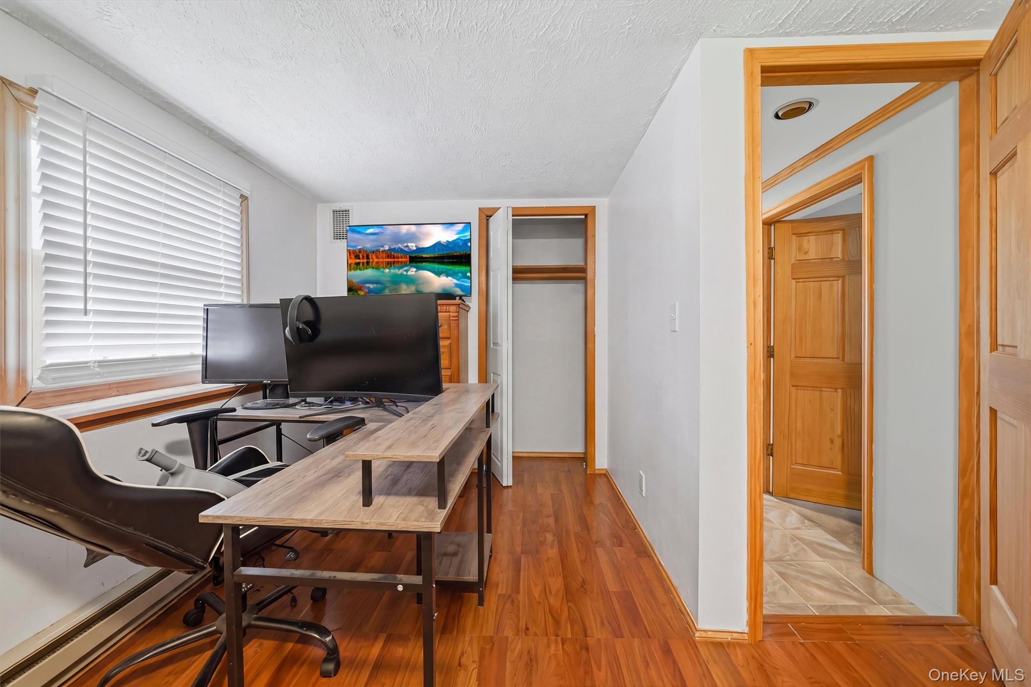 318 Beattie Road Washingtonville, NY 10992 - Photo 25 of 42 a workspace with furniture and wooden floor