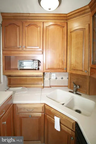 a kitchen with a refrigerator and a sink