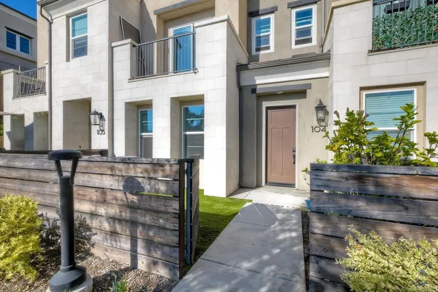 a front view of a house with outdoor seating