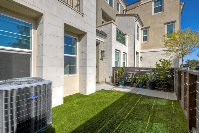 a view of an house with backyard space and garden
