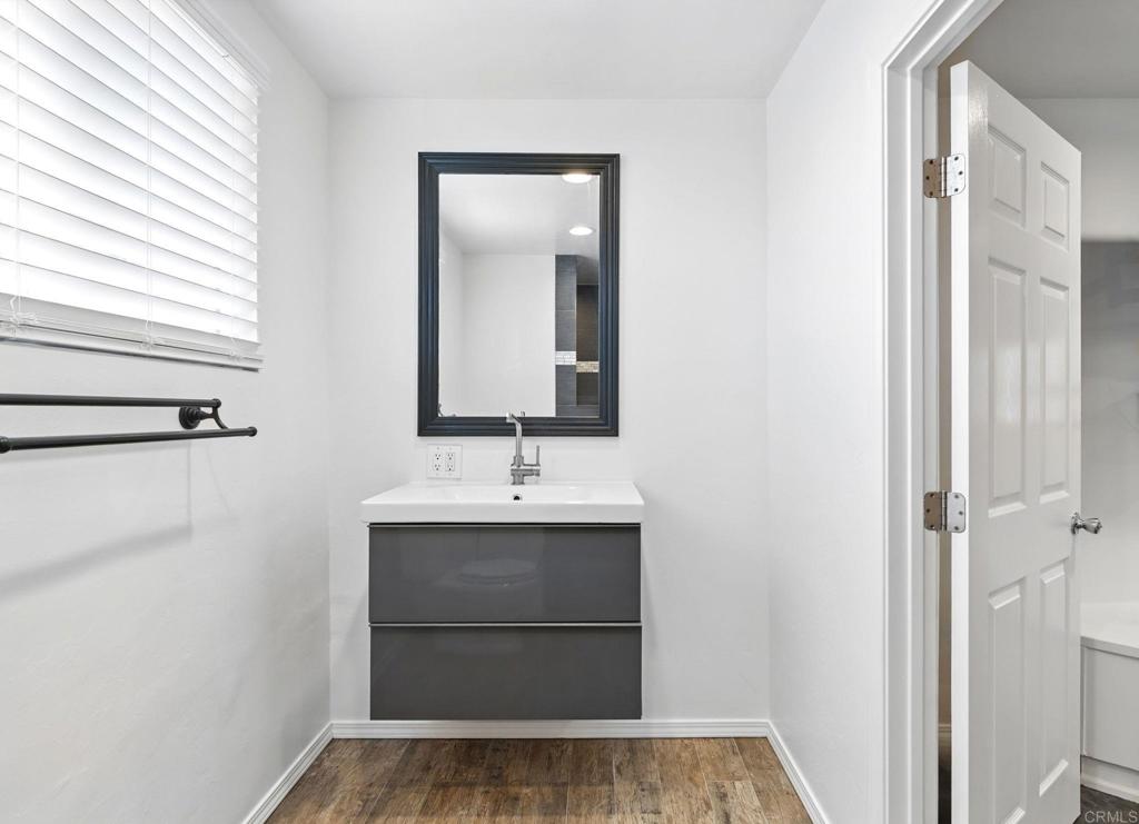 835 Dewitt Avenue, Unit B Encinitas, CA 92024 - Photo 12 of 22 a view of a bathroom with a sink and mirror