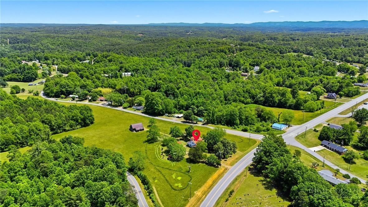 3450 Sparta Road North Wilkesboro, NC 28659 - Photo 32 of 34 a view of a city with lush green forest