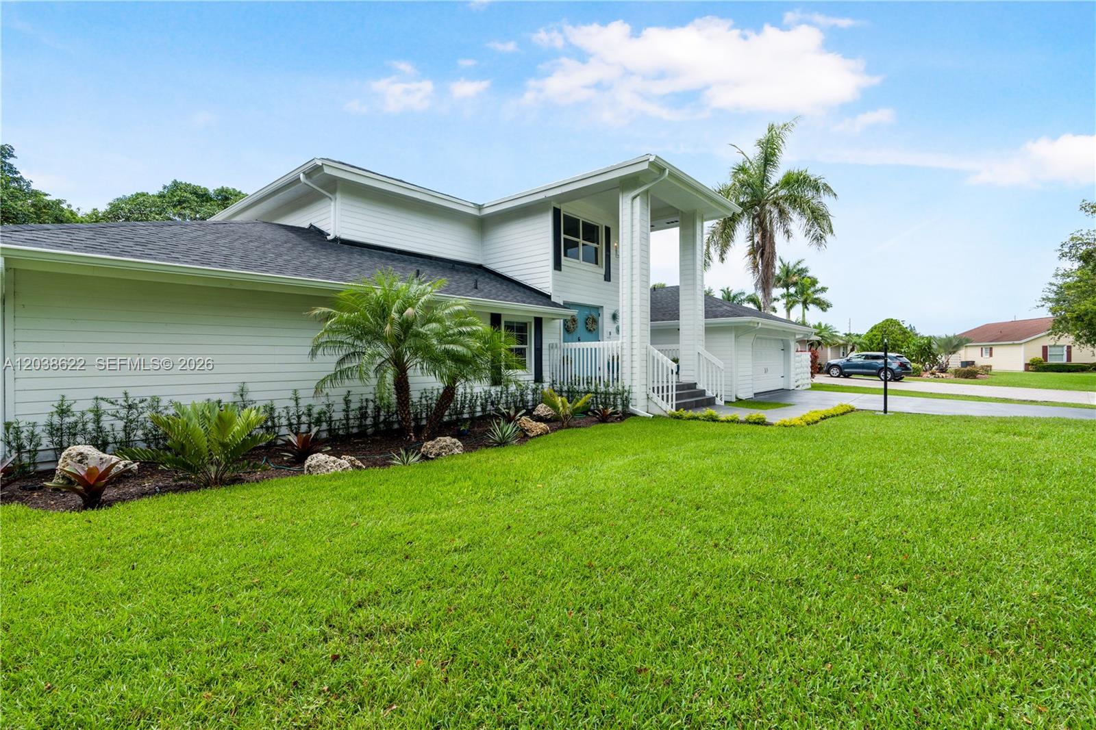 14830 Southwest 149th Street Miami, FL 33196 - Photo 2 of 43 a view of a house with a yard