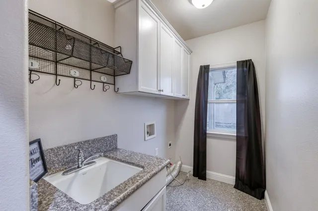 an empty room with closet and a chandelier fan