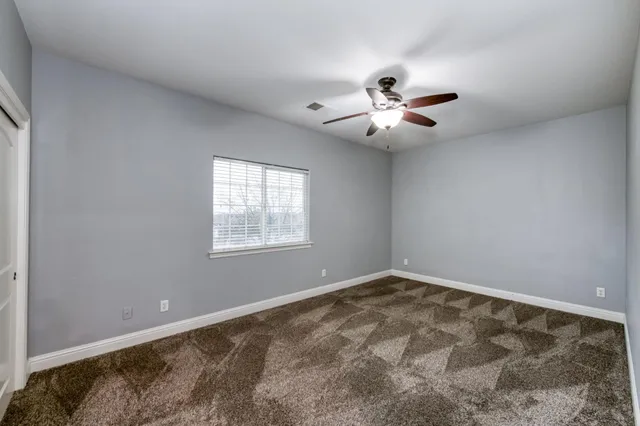 a view of a room with shelf on the wall