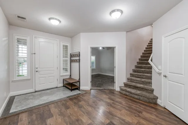 wooden floor and an entryway in a room