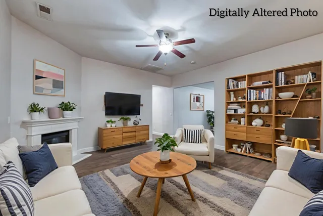 a kitchen with stainless steel appliances granite countertop a stove top oven a refrigerator a sink and white cabinets