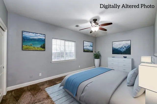 an empty room with windows and fireplace
