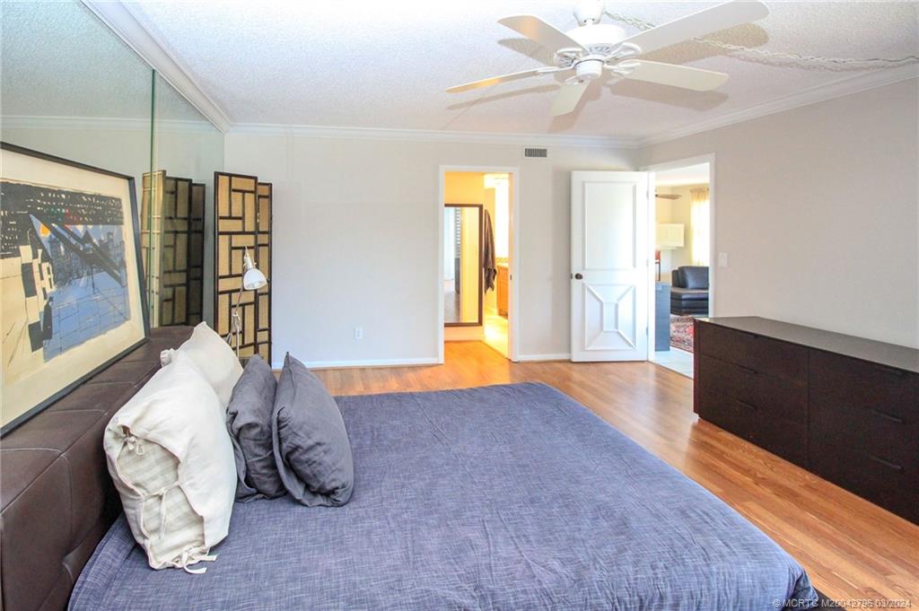 2641 Northeast Ocean Boulevard, Unit 101 Stuart, FL 34996 - Photo 19 of 41 a living room with furniture and wooden floor