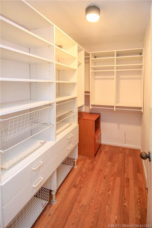 2641 Northeast Ocean Boulevard, Unit 101 Stuart, FL 34996 - Photo 29 of 41 a view of a room with wooden floor and a window