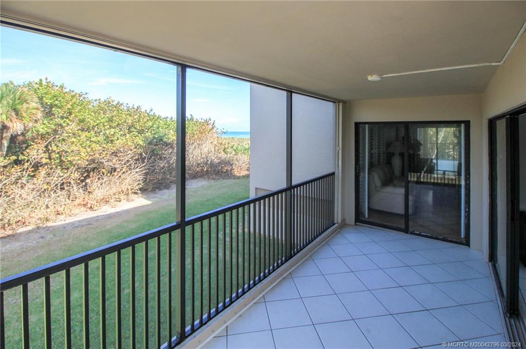 2641 Northeast Ocean Boulevard, Unit 101 Stuart, FL 34996 - Photo 9 of 41 a view of a glass door and an entryway