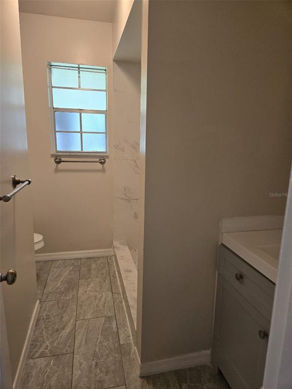1420 Simmons Road Kissimmee, FL 34744 - Photo 12 of 21 an empty room with windows