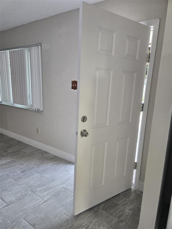 1420 Simmons Road Kissimmee, FL 34744 - Photo 3 of 21 a view of an empty room