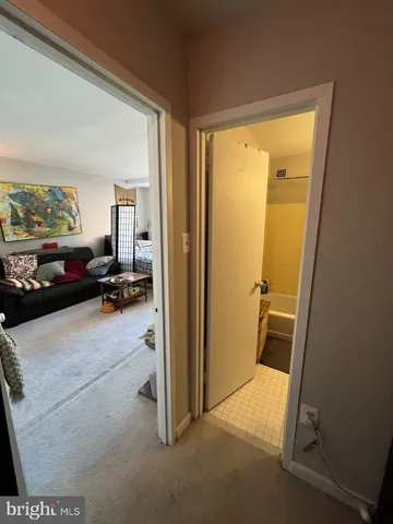 a view of a livingroom with furniture and a window