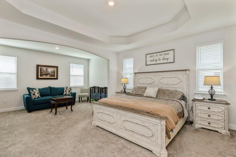 221 Sweet Tea Lane Freeport, FL 32439 - Photo 16 of 55 a bedroom with a bed and a couch